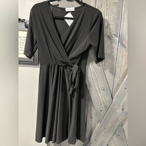 LBD for NYE!! Faux wrap dress with tie on side. Low V neck. Size Medium